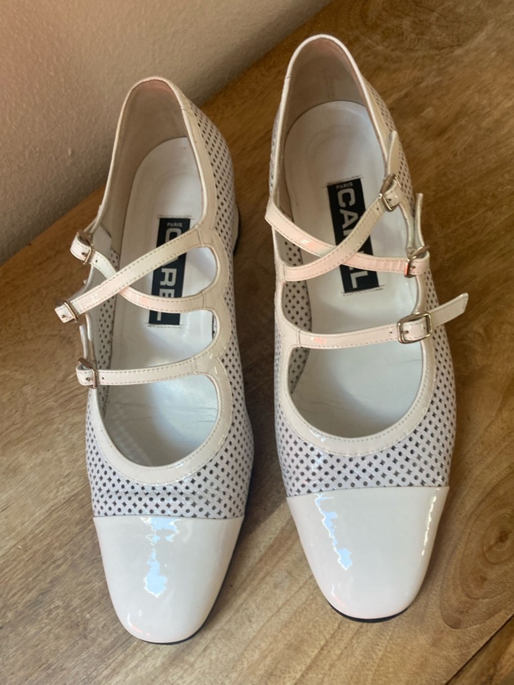 Carel Kina Kiss perforated pumps 
Patent Leather Mary Jane Pumps in White